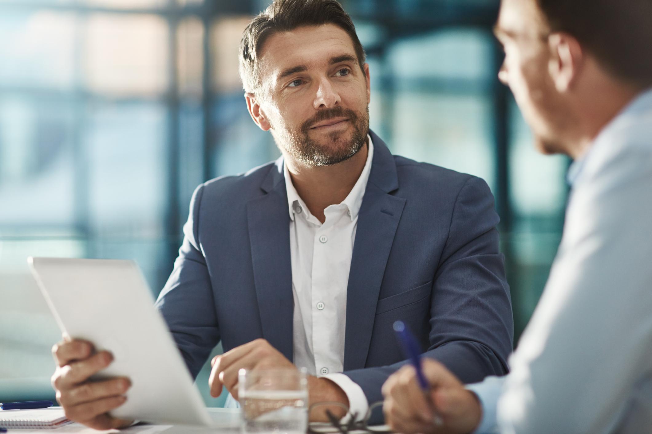 Image of Two Businessmen Meeting in the Office